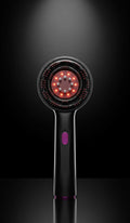 Brosse Hairflow allumée, lumière rouge LED, sur fond noir